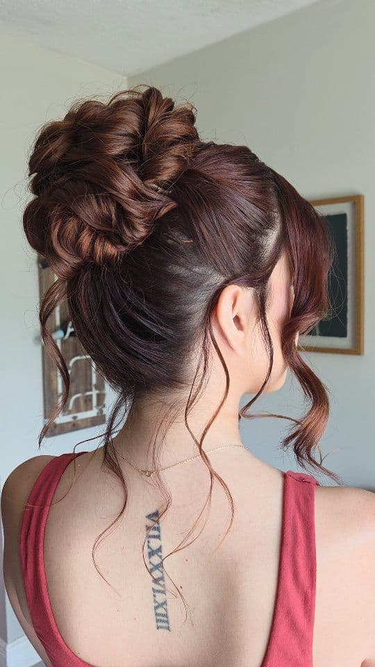 High textured bun with face-framing curls